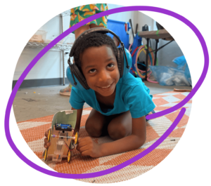 Photo: Child holding a robot they built